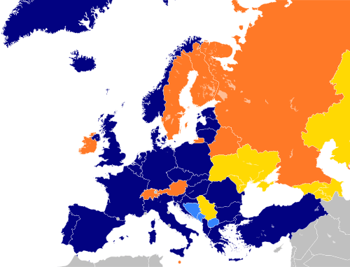A map of Europe with countries in blue, cyan, orange, and yellow based on their NATO affiliation.