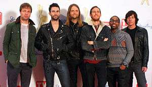 Maroon 5 are looking gently towards the camera.