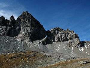 Martinsloch (Martins hole) is visible in the center of the Tschingelhörner in the Glarus Alps