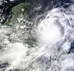 A satellite image depicting a well-developed tropical cyclone prior to striking Central America.