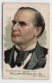 A cigarette card bearing a colour image of a politician, denoted to be "William McKinley Jr of Ohio". The grey-haired man's head points to the left with a neutral expression.