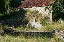 stone foundations in front of a wall