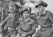Three men posing for a photograph wearing British Army uniform