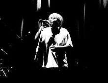 Black and white image of Meshell Ndegeocello singing
