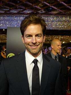Actor Michael Muhney, smiling in a suit