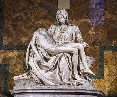  This marble statue shows the Virgin Mary seated, mourning over the lifeless body of Jesus which is supported across her knees.