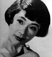 Glamorous headshot of a young Umeki, wearing a diamond necklace