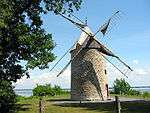 The windmill with Lake Saint-Louis in the background