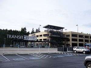 A parking garage and bus shelter