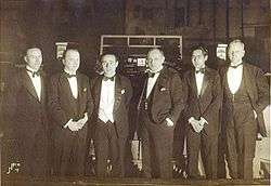 Six men in evening dress