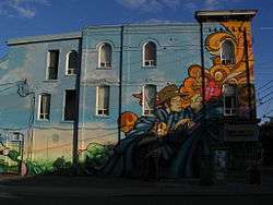 Colourful mural on building at sunset