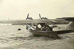 Twin-engined military amphibious aircraft in harbour