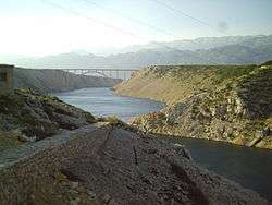 Reinforced concrete arch bridge across Novsko Ždrilo strait near Maslenica.