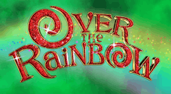The text "Over the Rainbow" in letters of mixed capitalisation, with the letters made up of red rubies set in gold frames; the letters 'O' are shaped as swirls. Behind the text is a rainbow, with a background of emerald green clouds on black.