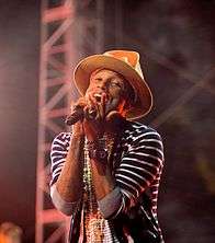 Color picture of singer Pharrell Williams singing at Coachella in 2014.