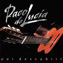 A flamenco guitar is depicted against a black background.