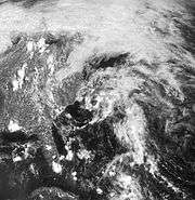Satellite image of a sprawling, disorganized area of clouds along the East Coast of the United States.
