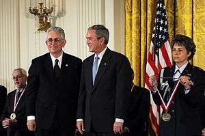 President George W. Bush presents the 2007 National Medal for Technology and Innovation to Dr. Adam Heller of the University of Texas at Austin at a ceremony in September 2008.