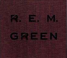 A crimson cover with rough hewn texture that has "GREEN" and "R.E.M." debossed on it in black