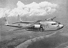 A large twin-engined propeller-driven transport aircraft in level flight