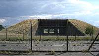 concrete missile silo covered in grass