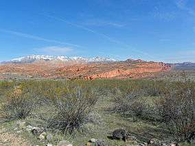 A photo of the Red Cliffs with Pine Valley Mountains in the background