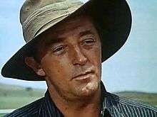 Screenshot of Robert Mitchum wearing a cowboy hat in the film The Sundowners in 1960