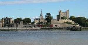The stone castle and cathedral stand next to the river, prominent against Rochester's skyline