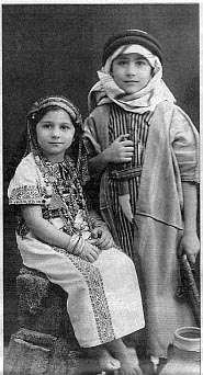 A photo of Edward Said and his sister as children, dressed in Arab-style clothing.