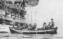 Selkirk, seated in a ship's boat, being taken aboard Duke.