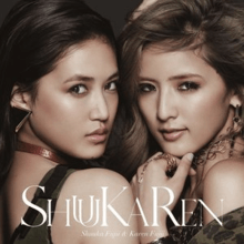 A close-up of two Japanese women (left to right: Karen Fujii and Shuuka Fujii) wearing jewellery and clothes. The title "ShuuKaRen" and the two women's name are superimposed on this shot.