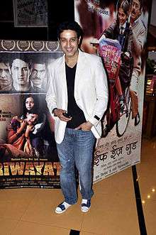 A man in white blazers at a film premiere