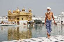 Sikh pilgrim at the Harmandir Sahib (Golden Temple) in Amritsar, India. The man has just had a ritual bath.