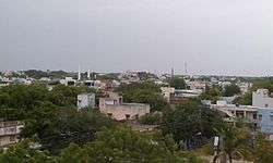 Image of the town with mosque amidst a housing locality