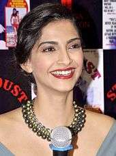 A shot of Sonam Kapoor, laughing away from the camera