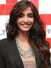 Sonam Kapoor is directly looking towards the camera.