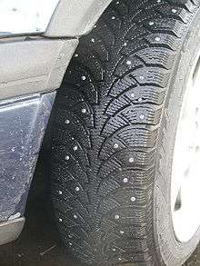 Nokian tyre with round metal studs, spike like protrusions to increase traction in ice