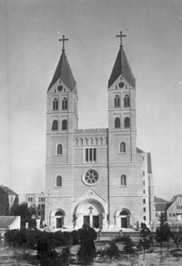 A black and white photograph of Saint Michael's Cathedral, from the front, with twin bell towers flanking the doorway