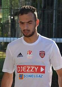 Algerian midfielder Kaddour Beldjilali, wearing the kit of his club USM Alger.