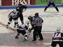 Gregg Johnson faces off against Barret Ehgoetz; Cincinnati Cyclones at South Carolina Stingrays, March 7, 2010.