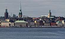 A landscape image of a city setting including a river.