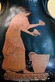 Photograph of a red-figure vase showing a woman selling food