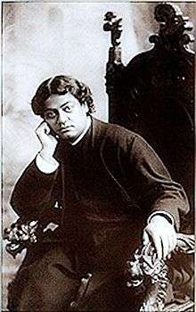 Image of Vivekananda relaxing in a chair.