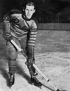 Syd Howe posing on the ice in a Philadelphia Quakers uniform