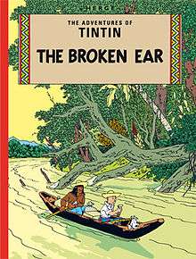 Tintin and Snowy and their guide are rowing a canoe on a jungle river.