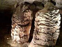 These two large stalagmites were named "The Hall of Giants" by the first explorers, a group of twelve women, who discovered them in 1867 at Fantastic Caverns.