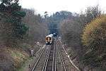 Photograph showing the south portal of Somerhill Tunnel, with a London-bound train about to enter.