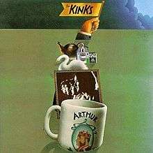 The front cover artwork of the album. A white coffee mug with the word "Arthur" and a picture of two men sits in the foreground; a sepia-tone profile photo of the Kinks sits behind it; a swan and other small, various objects sit behind the photo. A hand raises a flag from behind the pileup, which reads "The Kinks". These objects sit on a green background, with the exception of the top border, which is covered by storm clouds.