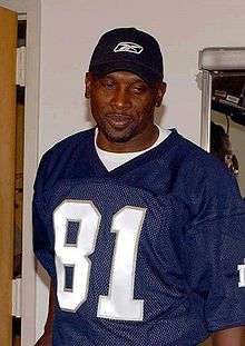 A picture of Tim Brown wearing a jersey.