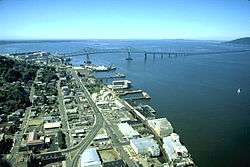 City of Astoria, Oregon in the foreground with the Astoria–Megler Bridge spanning the Columbia River to Washington State